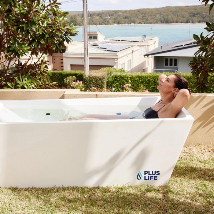 PlusLife Ice Bath in use by women near the beach