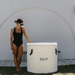 Kalm Pod Ice bath lid off with woman standing next to it